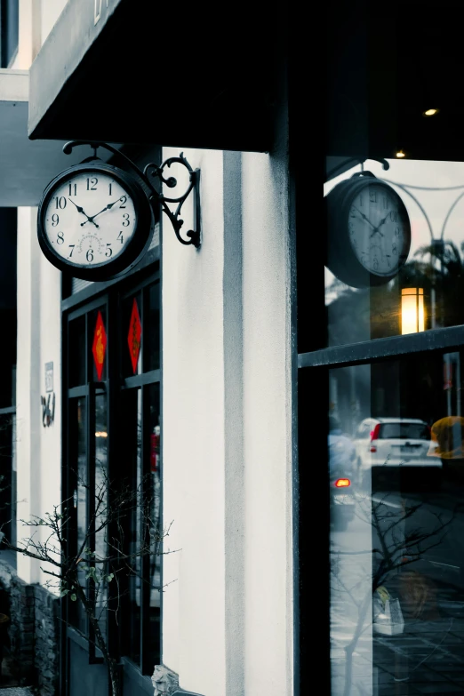 a store with clocks on the front of it