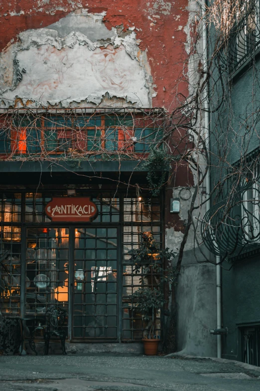 an old building with a street sign in the doorway