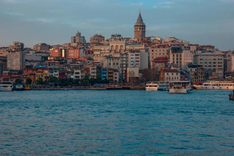 the water in front of a city on a cloudy day