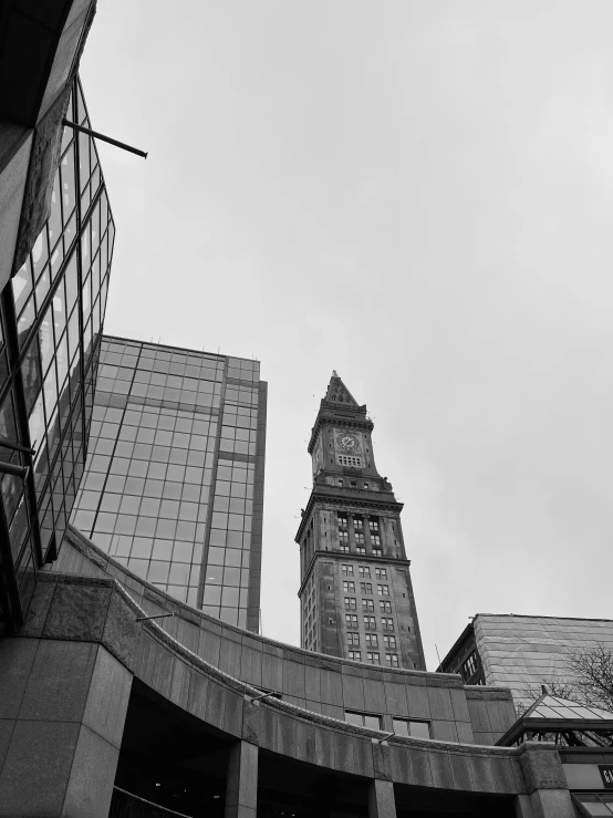 two high rises are pictured in a cloudy sky