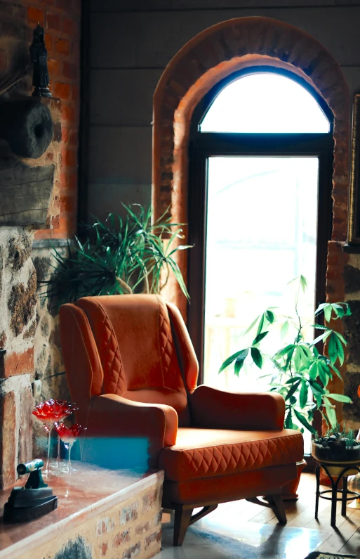 the living room has been decorated in brick with a nice window and plant