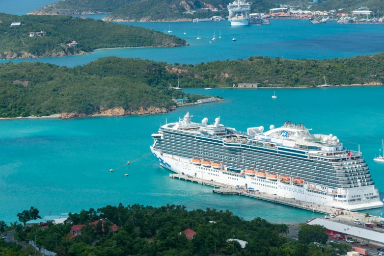 a large cruise ship is docked at the dock