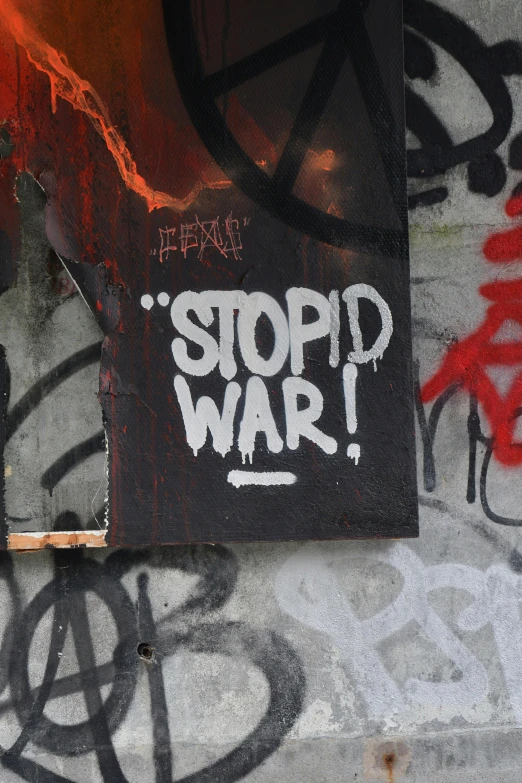 a picture of graffiti on the wall with a tag written