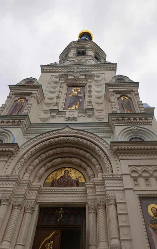 an image of a church entrance with a clock on the tower