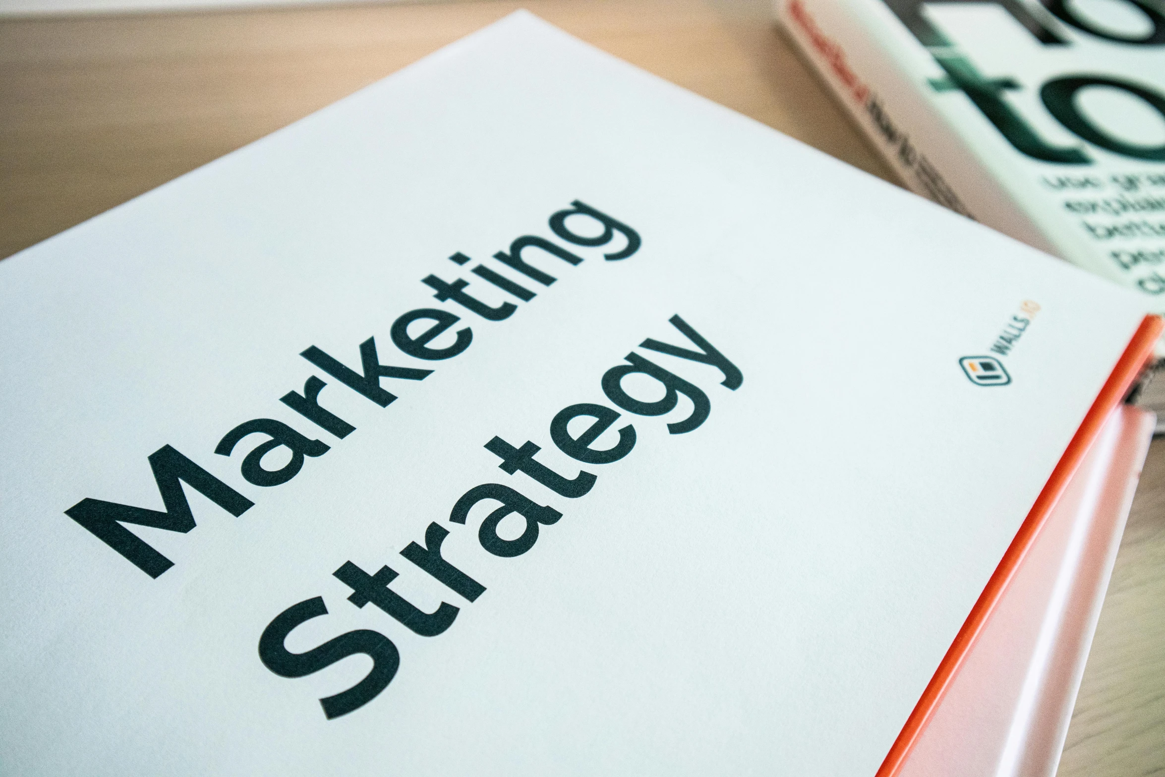 two book covers with the words marketing strategy