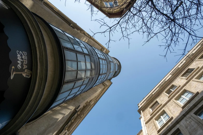 a clock tower is seen from below the sky