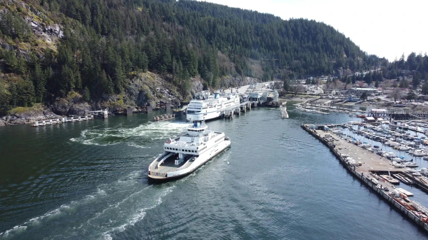 boats are in the water by some dock