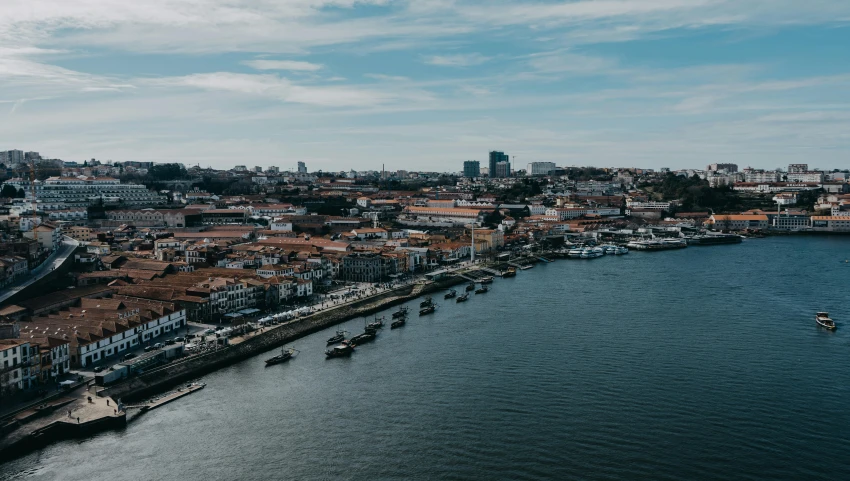 a waterway running between a city and a river