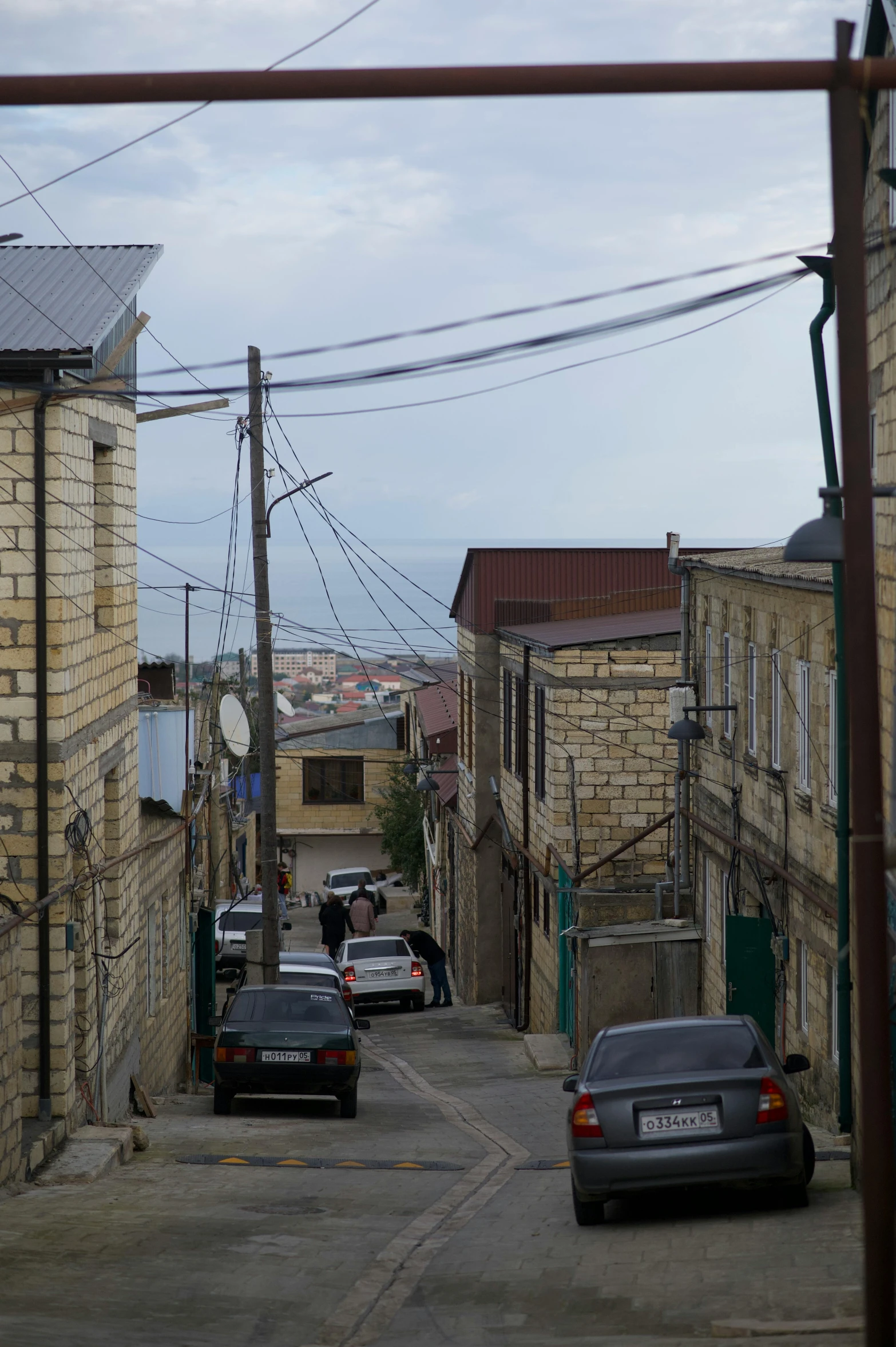 a street lined with old buildings and power lines