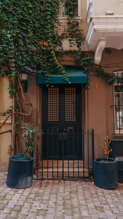 a black door is on an old building