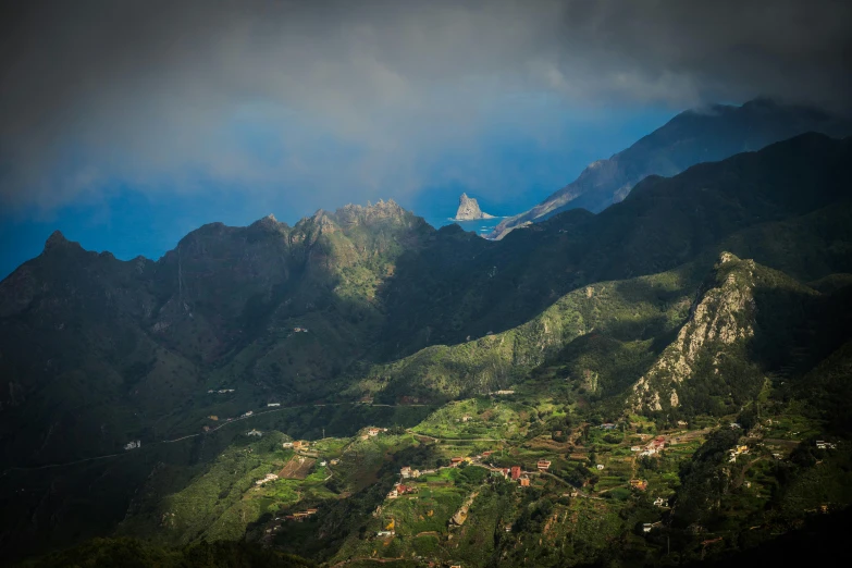 a large mountain range that is very green