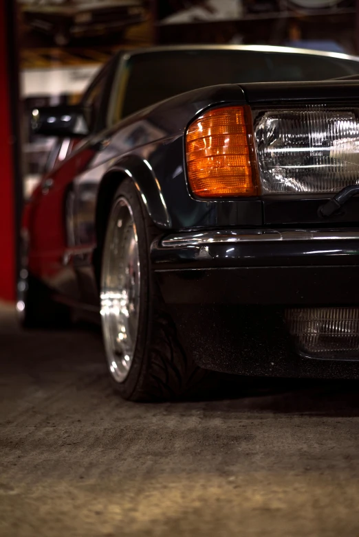 a mercedes benz w110 with chrome rims and lights