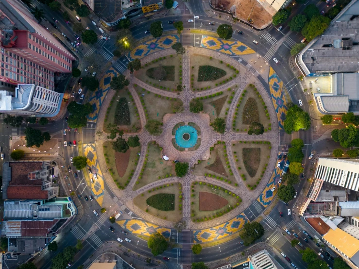 an aerial view of the city has a circular area with several different lights and shapes