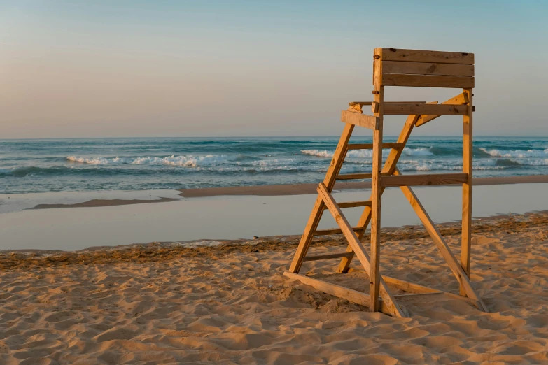 ladder made from boards on the beach looking out at the ocean