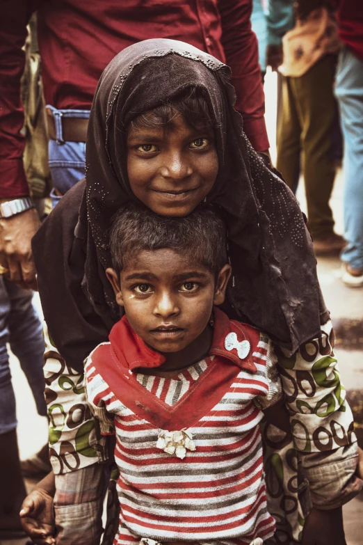 a woman and child are standing close together