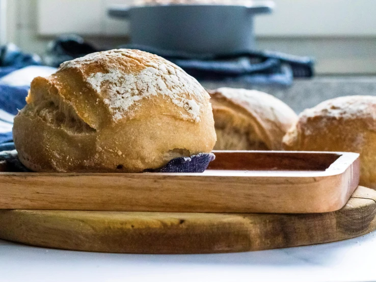 some food is in a wooden plate on a counter