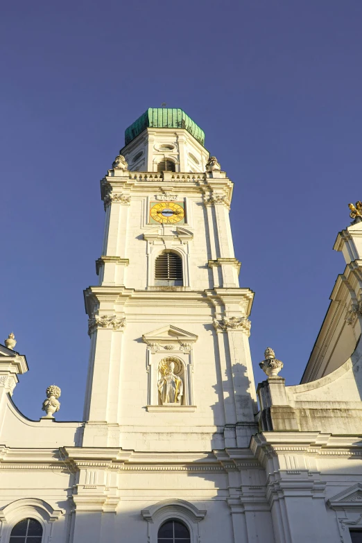 the clock on top of the building is very tall