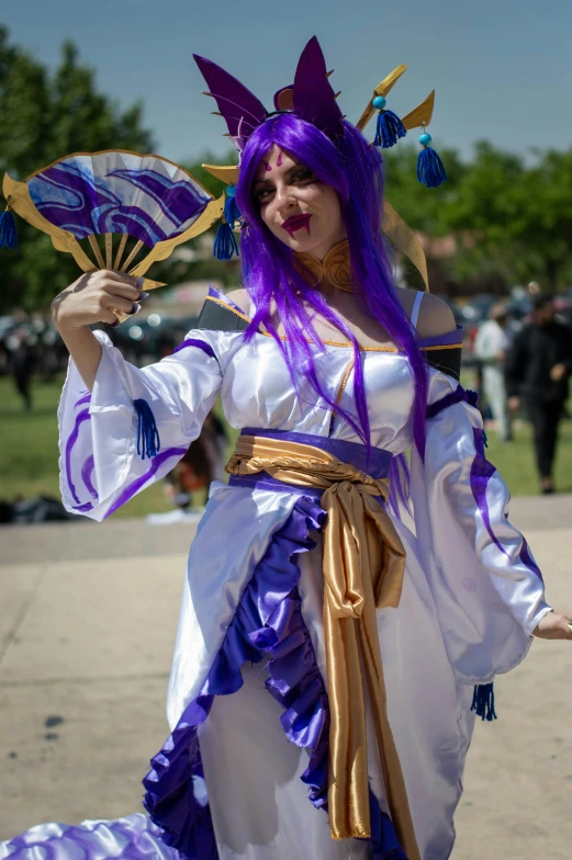 an elaborately dressed woman in a purple and white dress