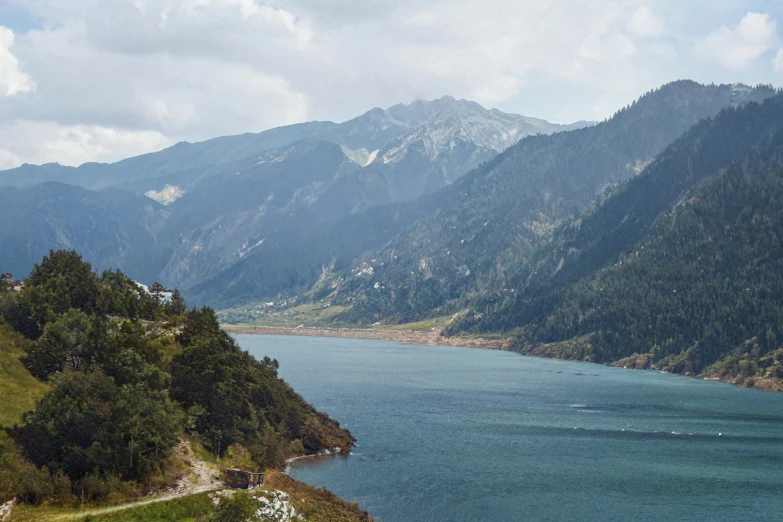 a scenic mountain range overlooks a large lake