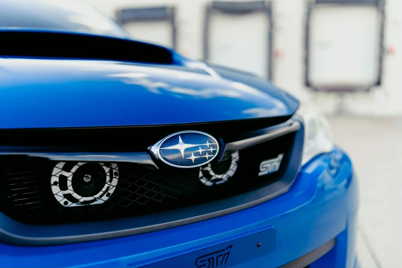 blue scissor on the front bumper of a subarunt