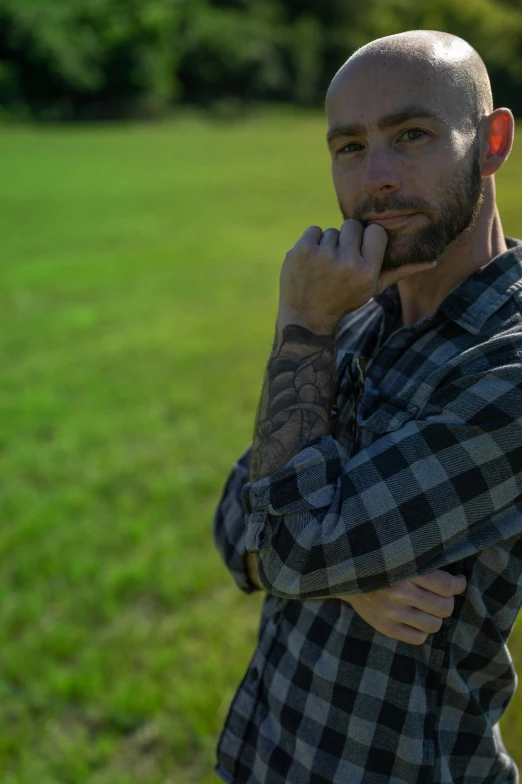 an image of a man that is standing in the grass