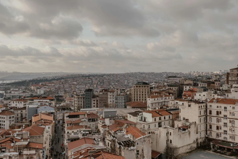 the city is covered with rooftops in an urban setting