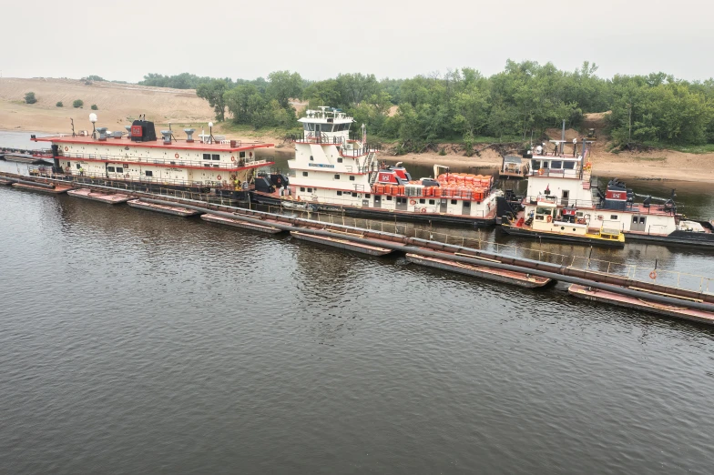 an aerial view of three boats on water