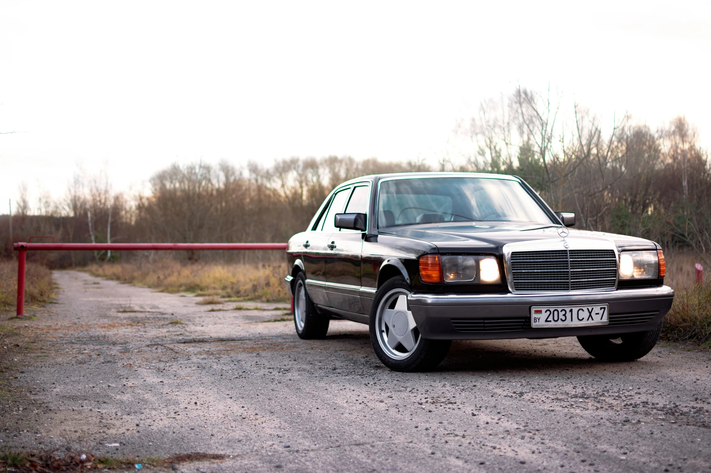 the mercedes benz may be on the side of a road