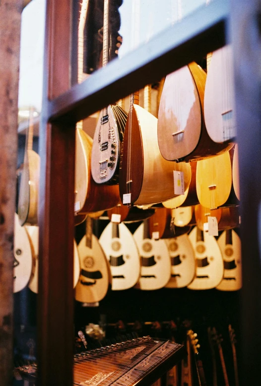 guitars on display inside a shop on a building