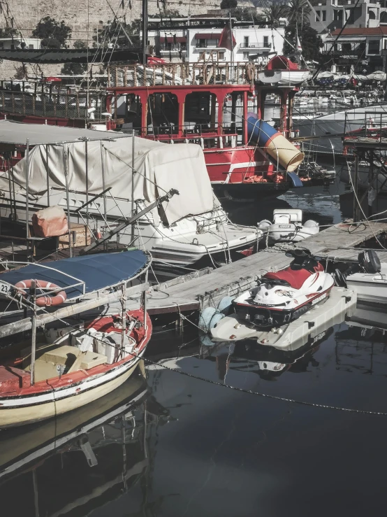 a bunch of boats docked in the water