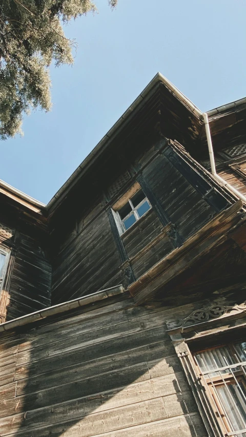 a very old building with a large windows and a roof