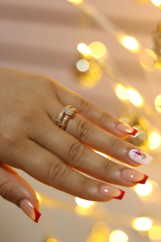 a beautiful woman holding a ring on her hand