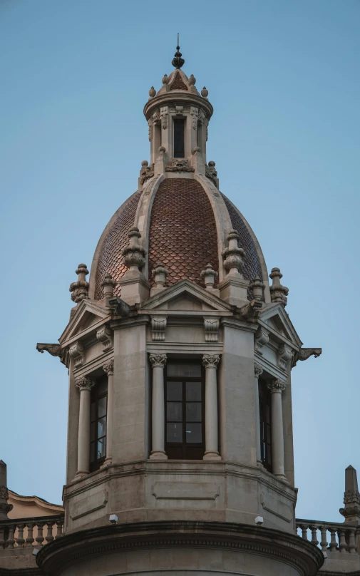 dome of a stone building with a clock