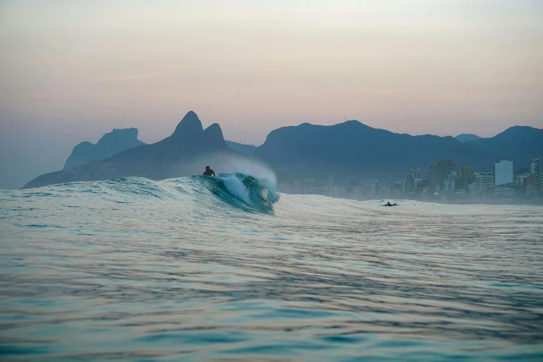 a surfer riding the waves in the ocean