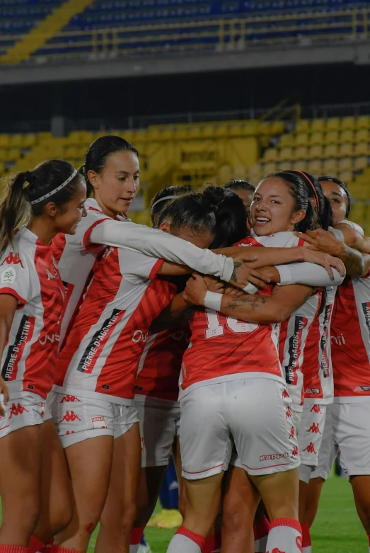 an asian women's soccer team celeting