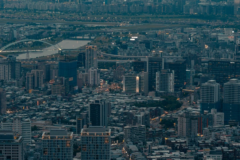 a cityscape with lots of tall buildings and traffic lights