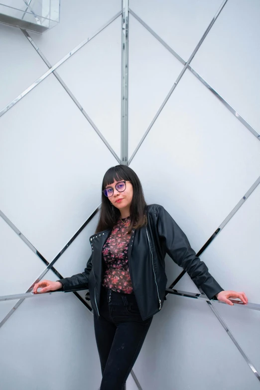 woman in front of wall with futuristic surface