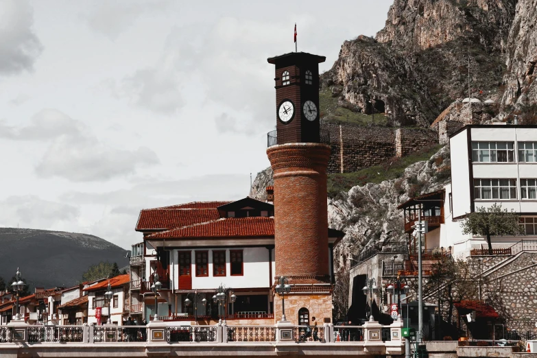 the view of a town near water in mountains