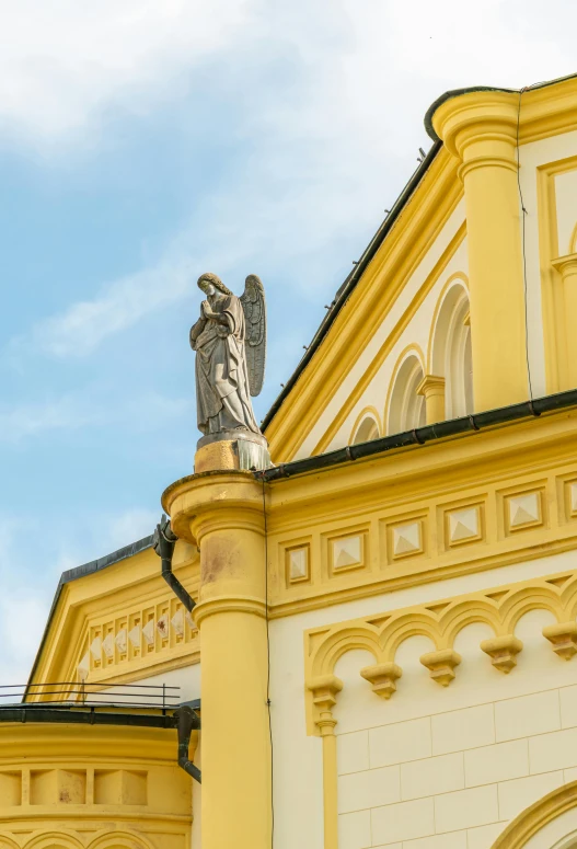 a statue on top of the top of a building