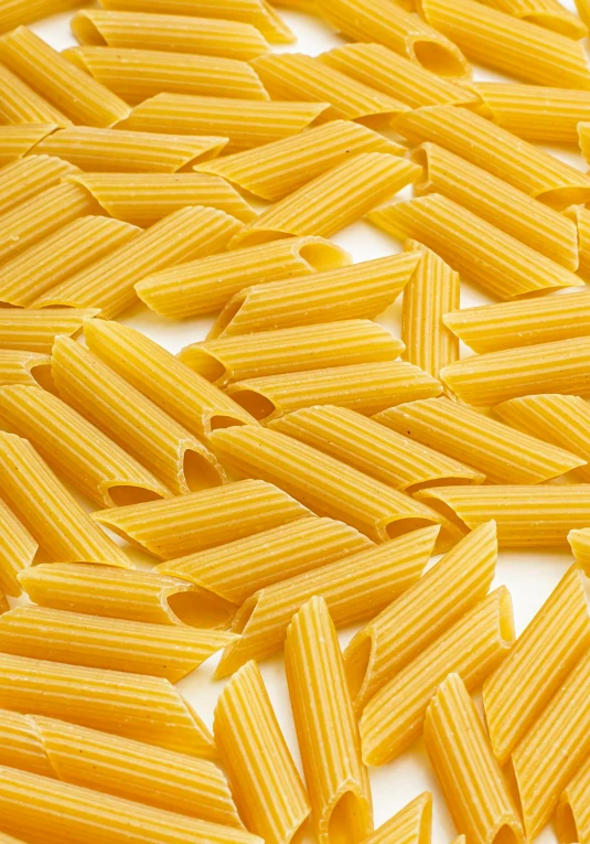 a very close up of noodles on a white surface
