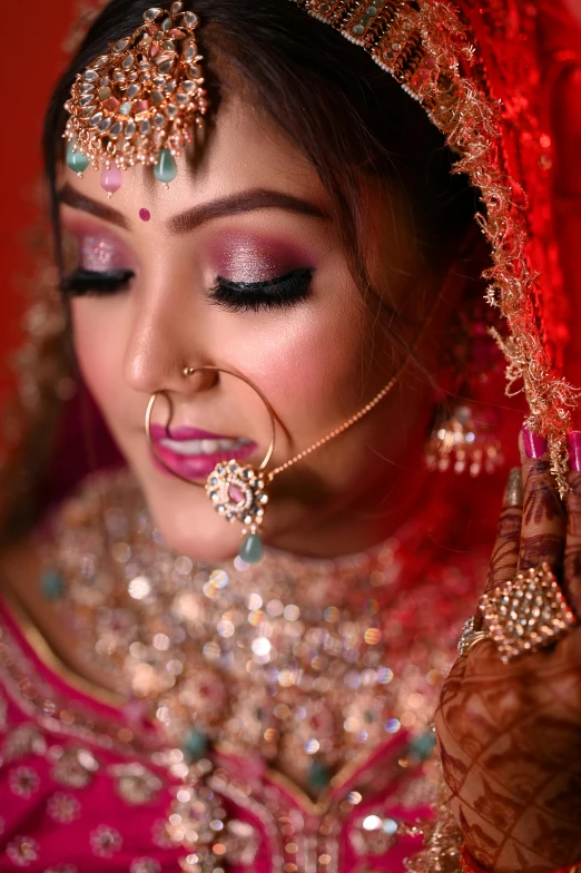 a bride in a bridal po with bright makeup