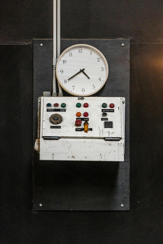 a clock mounted on the side of a wall
