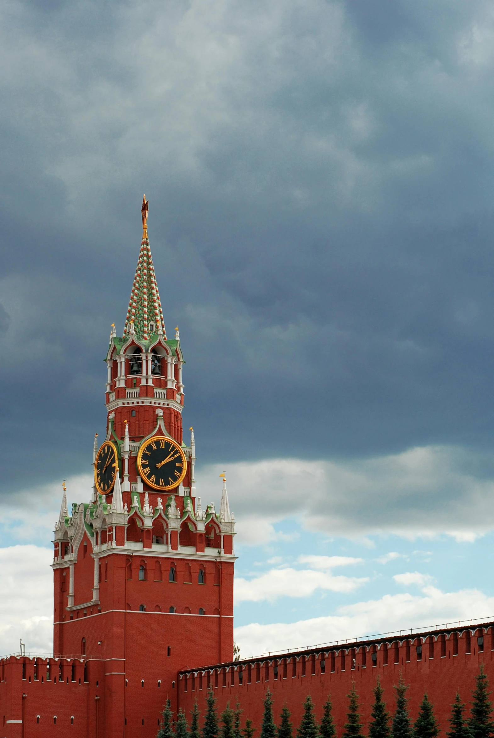 a building with clock face on top on a cloudy day