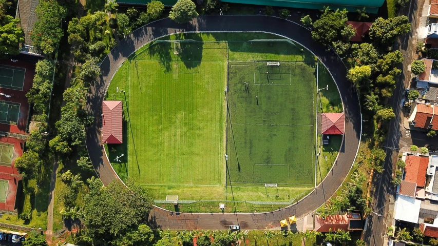 a soccer field in an urban neighborhood