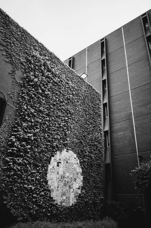 a building with black bricks against a grey sky