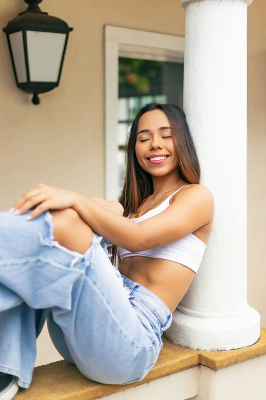 beautiful woman sitting down with her knees folded out