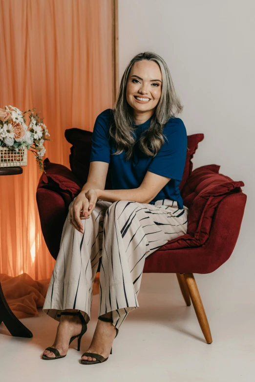 the woman is posing in her chair for a po