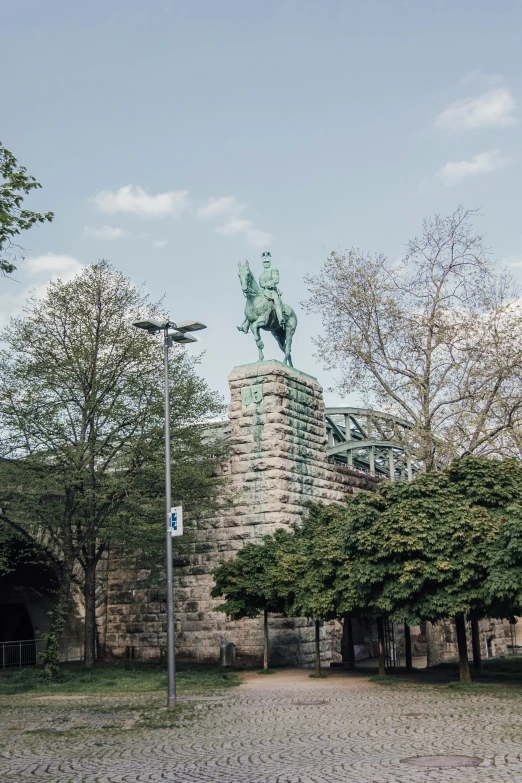 an old building with a statue atop it