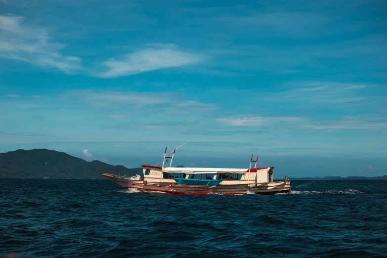 an empty boat in the middle of the water