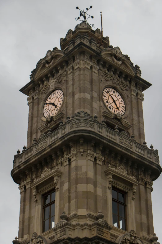 a large building with clocks all on its sides